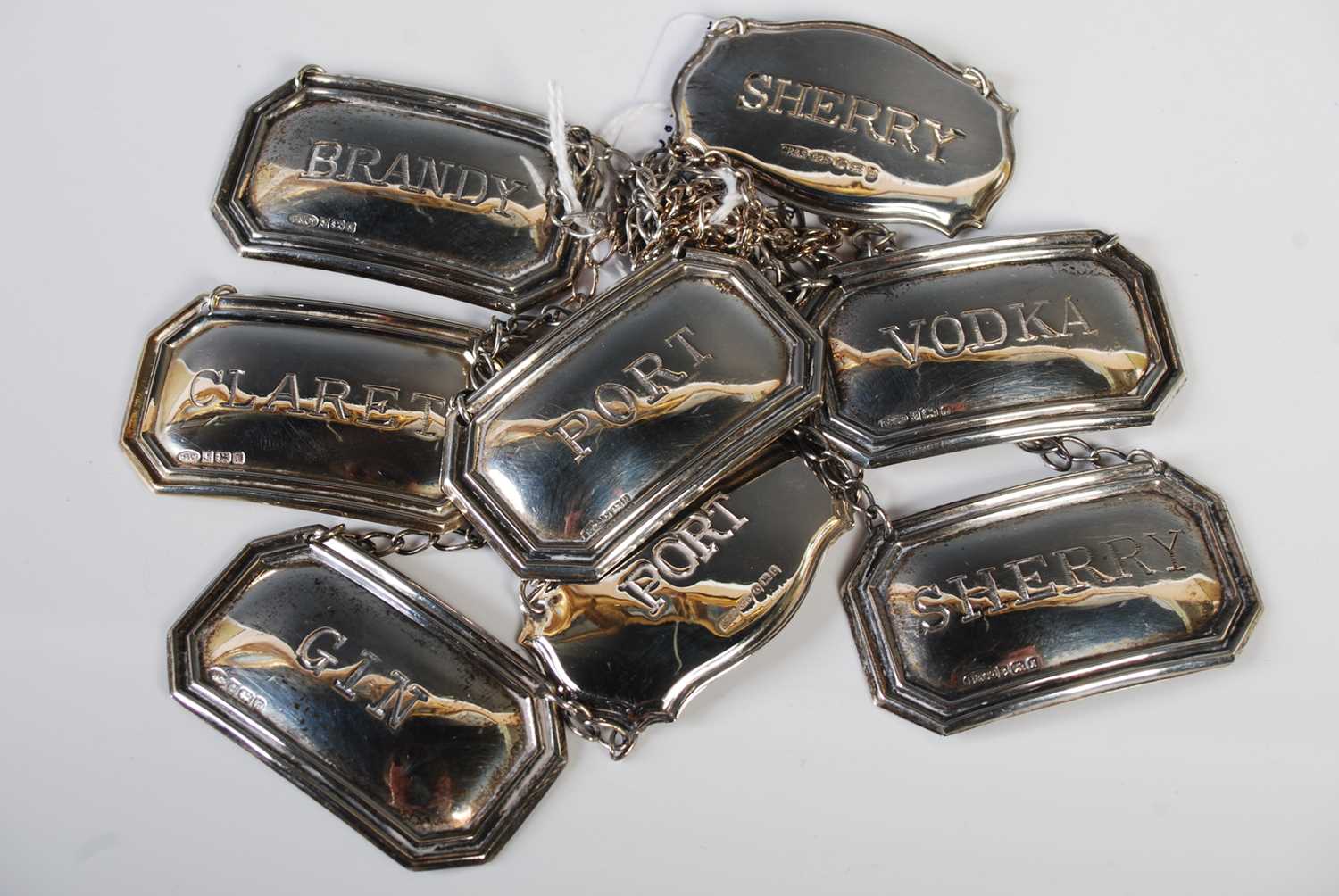 Lot 127 - A collection of eight assorted spirit labels...
