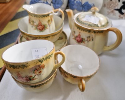 Lot 18 - A Victorian part tea set, the off-white ground...