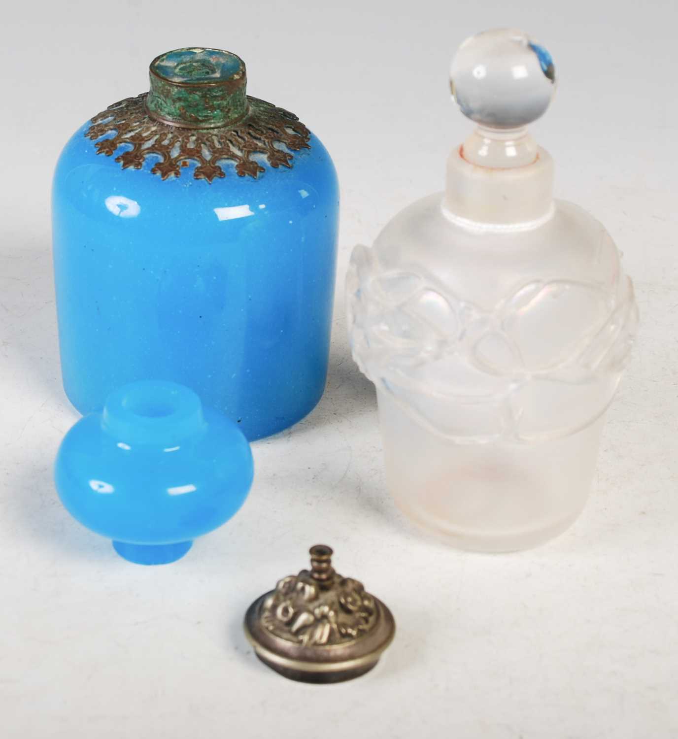 Lot 8 - An iridescent glass perfume bottle with clear...