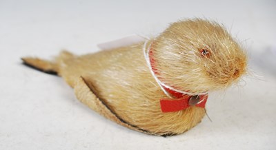 Lot 110 - Two clockwork bird toys and a seal toy.