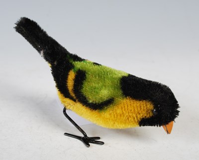 Lot 110 - Two clockwork bird toys and a seal toy.