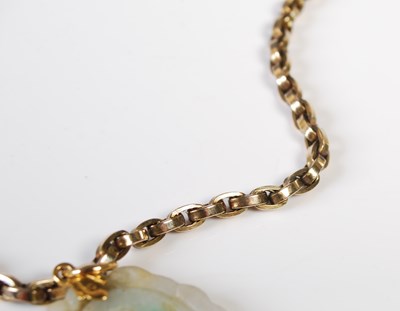 Lot 33 - A 9ct gold necklace suspending a Chinese...