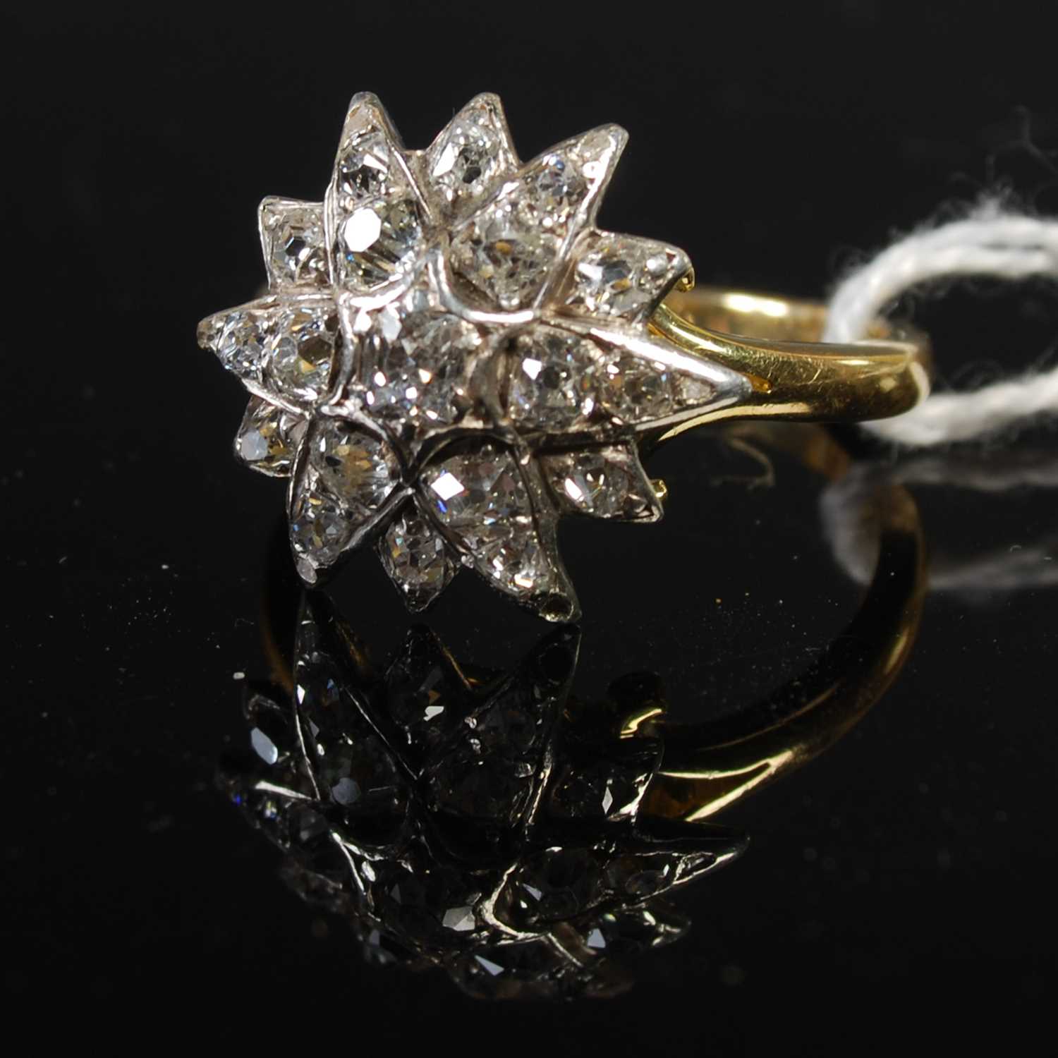 Lot 41 - An 18ct yellow gold, silver and diamond set...