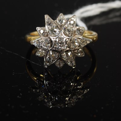 Lot 41 - An 18ct yellow gold, silver and diamond set...