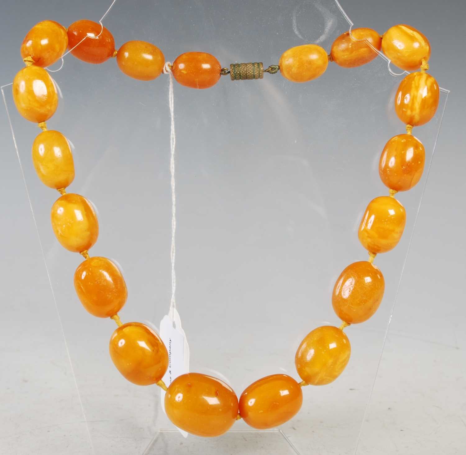 Lot 53 - A vintage butterscotch amber graduated bead...