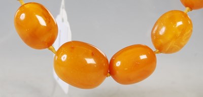 Lot 53 - A vintage butterscotch amber graduated bead...