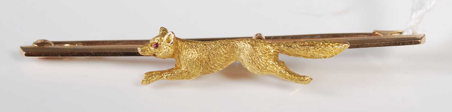 Lot 74 - An early 20th century yellow metal bar brooch,...