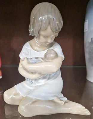 Lot 5 - A Royal Copenhagen porcelain figure of a girl...