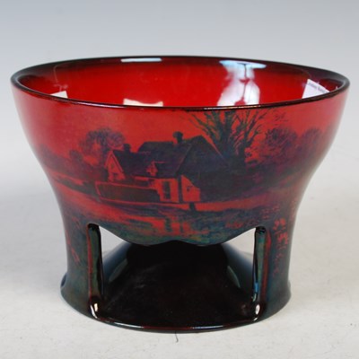 Lot 25 - A Royal Doulton flambé bowl, raised on three...