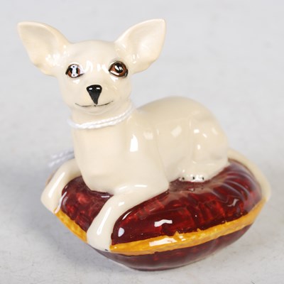 Lot 33 - A Beswick model of a Chihuahua lying on a...