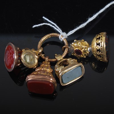 Lot 56 - A group of five assorted seal fobs suspended...