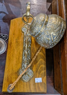 Lot 390 - An antique brass bell with Latin inscription...