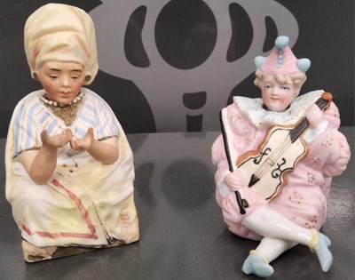 Lot 19 - Two Bisque nodding head figures, one in the...