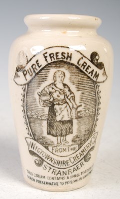 Lot 31 - A 19th century stoneware cream pot with black...