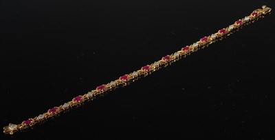 Lot 37L - A 9ct gold, ruby and diamond set articulated...