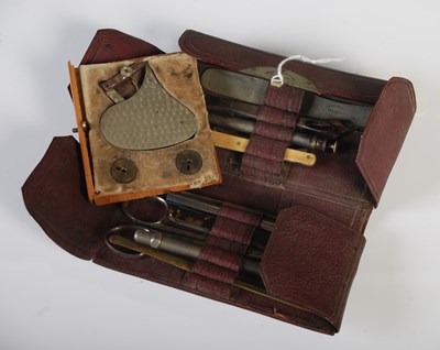 Lot 105 - A vintage leather cased manicure set, 'Evans &...