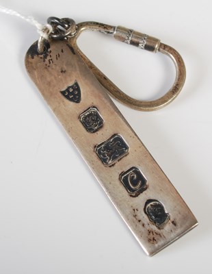 Lot 137 - A modern silver keyring with London hallmarks,...