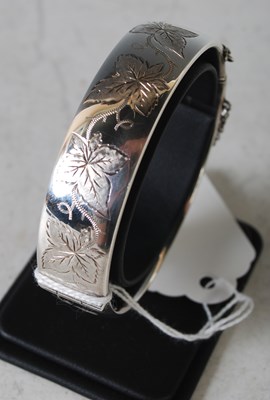 Lot 168 - A Birmingham silver hinged bangle with...