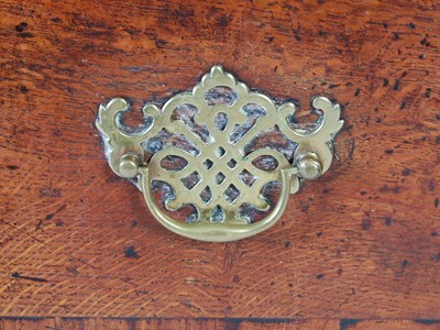 Lot 45 - A George III oak dresser, the rectangular top...