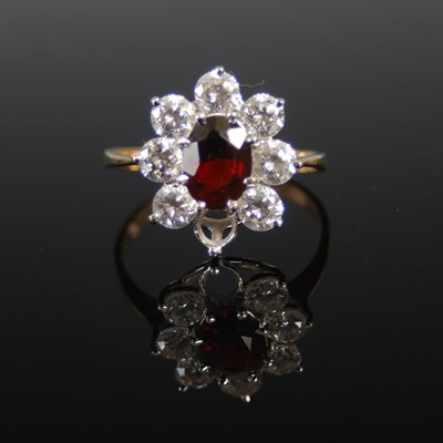 Lot 77 - A 9ct gold almandine garnet and rare-earth...
