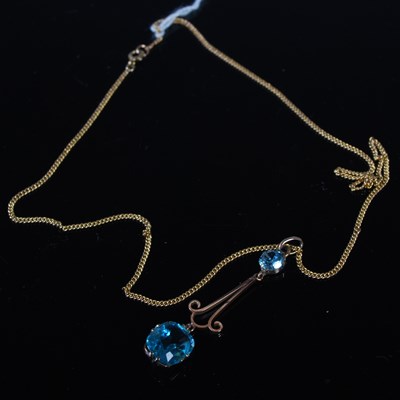 Lot 62 - A vintage yellow metal necklace suspending a...