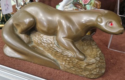 Lot 18 - An Art Deco style bronzed composite figure of...