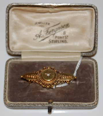Lot 30 - A 15ct gold and diamond chip brooch, gross...