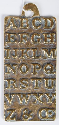 Lot 303 - An antique brass alphabet plaque teaching aid,...