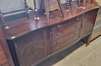 Lot 694 - A pine sideboard fitted with a bank of four...