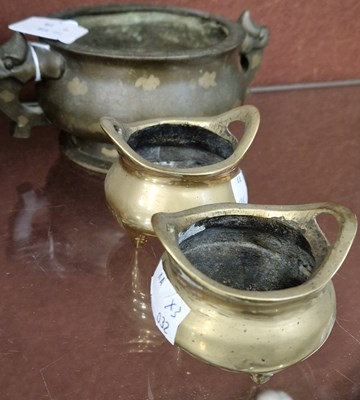 Lot 9 - A Chinese bronze twin-handled censor decorated...