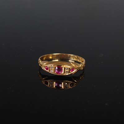 Lot 30 - An 18ct gold ruby and diamond chip ring, size '...