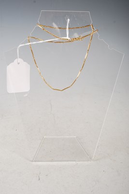 Lot 39 - A high carat yellow metal rectangular link...