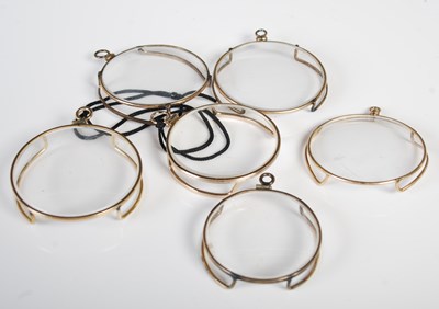 Lot 72 - Six antique yellow metal mounted monocles.