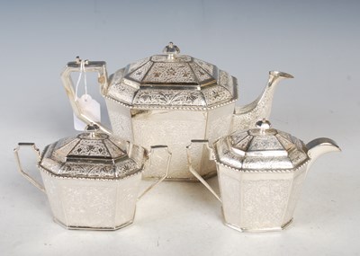 Lot 121 - An Indian white metal three-piece octagonal...
