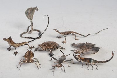 Lot 139 - A collection of eight assorted white metal...