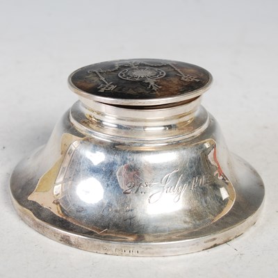 Lot 149 - A London silver circular inkwell, the hinged...