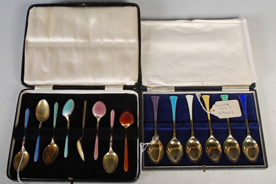 Lot 163 - A cased set of six silver gilt and coloured...