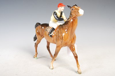 Lot 168 - A Beswick model of a jockey and racehorse,...