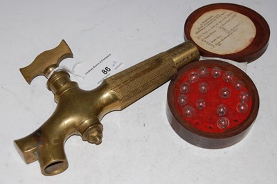 Lot 86 - Whisky/ Spirits interest - a brass whisky...