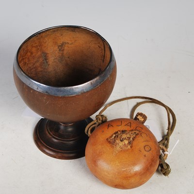 Lot 214 - An antique white metal mounted coconut cup on...